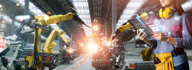 istock Engineer check and control welding robotics automatic arms machine in intelligent factory automotive industrial with monitoring system software. Digital manufacturing operation. Industry 4.0 1394879126