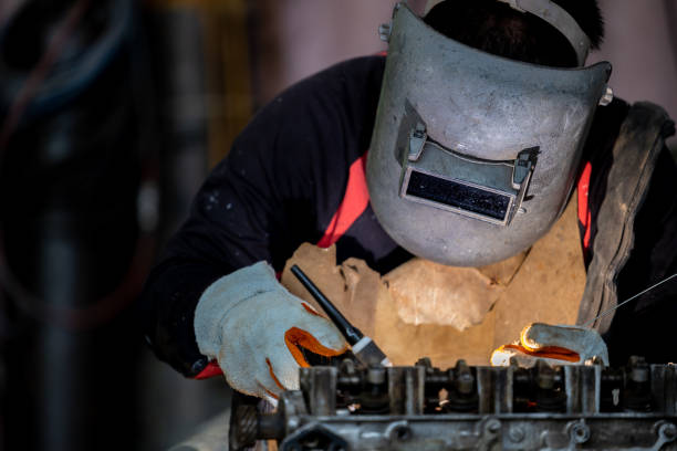 istock Industrial welder worker metal welding steel works using argon arc welding machine to weld steel at factory, Metalwork manufacturing and construction maintenance. 1394879918