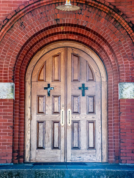 istock Wooden doors in arched doorway 1394881728