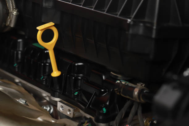 istock The mechanic is checking the engine oil. 1394882671