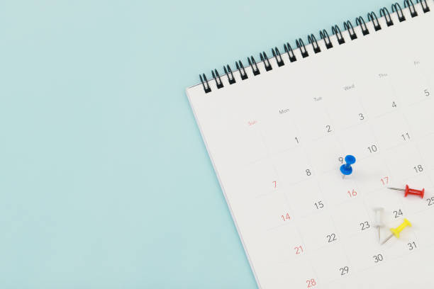 istock calendar on the table blue. empty copy space for text. concept for busy timeline organize schedule,appointment and meeting reminder. planning for business meeting or travel holiday planning concept. 1394882716
