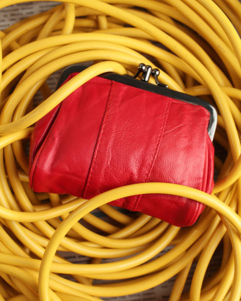 istock Red purse and yellow cable 1394883594