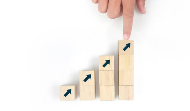 istock Business connecting piece of multi wood chart blocks steps in hand 1394885166