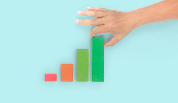 istock Business connecting piece of multi wood chart blocks steps in hand 1394885167