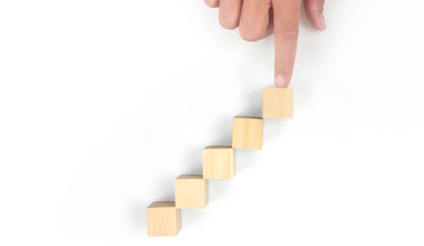 istock Business connecting piece of multi wood chart blocks steps in hand 1394885172