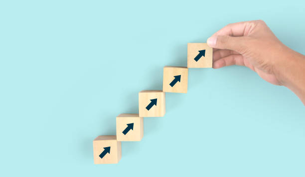 istock Business connecting piece of multi wood chart blocks steps in hand 1394885174