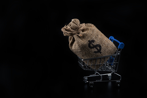 Bag with american dollar symbol on black background