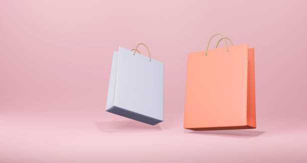istock 3D paper bag on pink background. Online shopping concept. 3D render. 1394886272