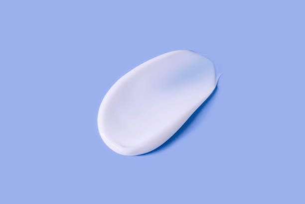 istock cosmetic smear of cream on a paste background 1394889505