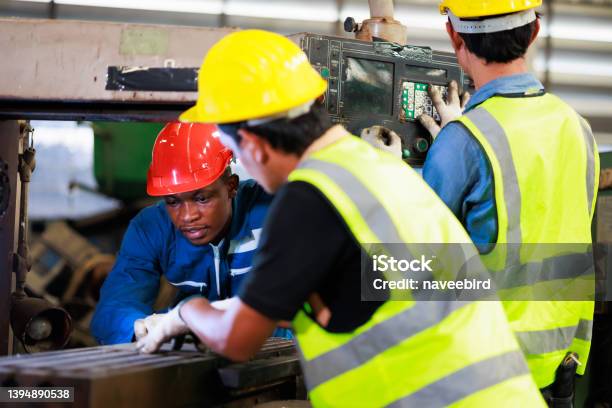 Training Trainee Concept Yang Male African American Engineer Explain The Procedure For Using The Correct Metal Machine At Factory Stock Photo - Download Image Now