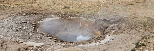 Photo of little geysir in the Haukadalur Valley geothermal area, Iceland. Boiling hole area (geyser), hot springs