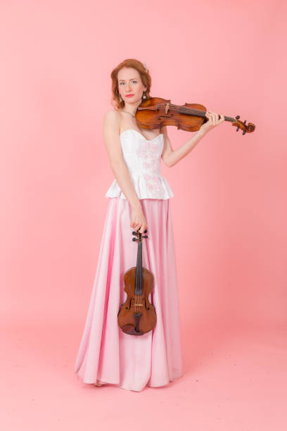 istock girl with a violin and viola 1394892471