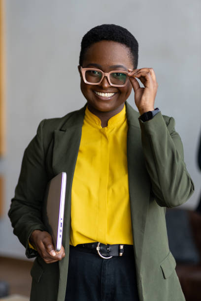 istock Happy young black woman with posing with eyeglasses 1394895530