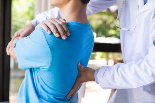istock Modern rehabilitation physiotherapist with young man. 1394898285