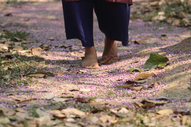 istock Walking upon flower covered road 1394898313