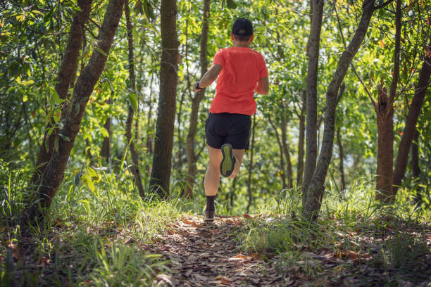 istock Woman hiker hiking on forest trail 1394899865