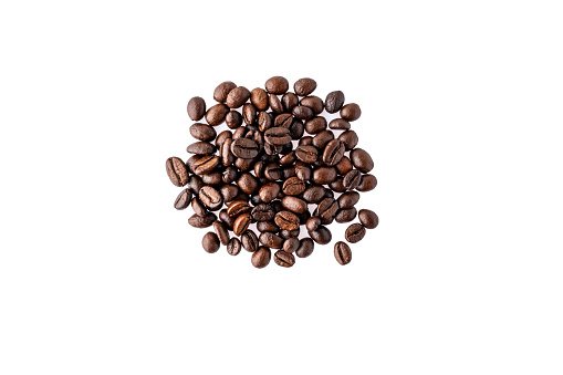 Cut out isolated textured coffee beans on white horizontal background, copy space, top view. Natural energy ingredient on blank backdrop. Fresh grains studio shot
