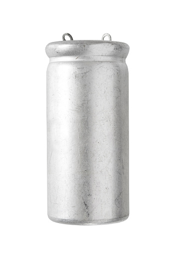 Old aluminum electrolytic capacitor isolated on white background