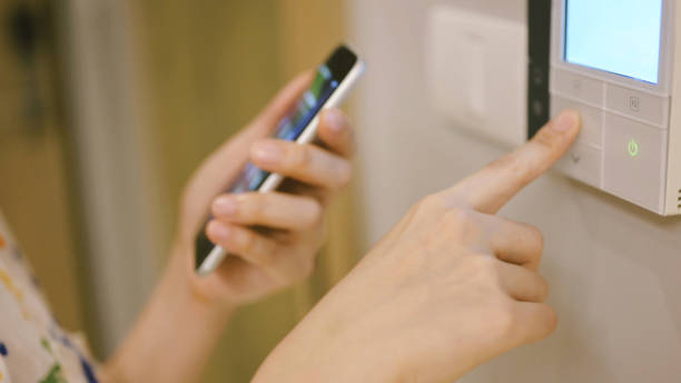 istock Home intelligent home automated sync her mobile phone with app temperature and light 1394901997