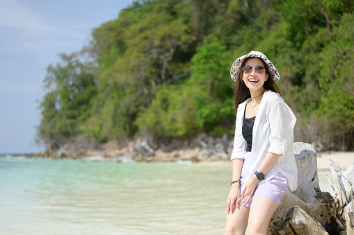 Summer asia thailand Asian tourist travel walk on white sand beach resort enjoy nature around herself refresh her self joyful good memory moment