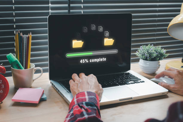 transfer files data system relocation concept, person hand using laptop computer waiting for transfer file process with loading bar icon on virtual screen. - sharing data file document imagens e fotografias de stock