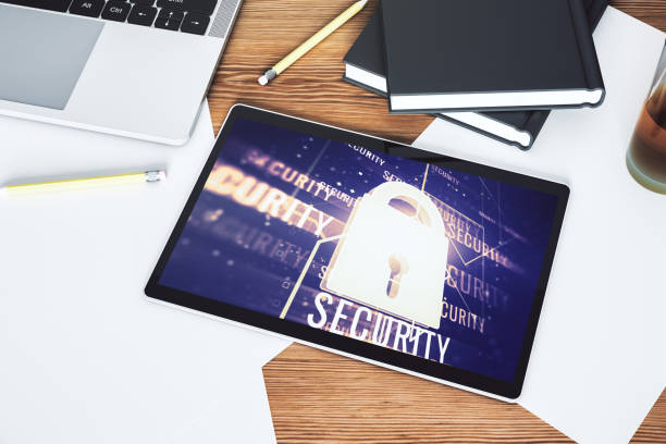 istock Creative idea concept with lock symbol and microcircuit illustration on modern digital tablet screen. Protection and firewall concept. Top view. 3D Rendering 1394903880