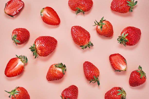 istock Ripe strawberries on a pink background. Beautiful background for the designer, flat lay. Delicious natural dessert 1394904014