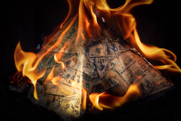 global financial pyramid based on the dominance of the dollar. world management concept. conspiracy theory. collapse of the dollar's financial system. money is burning on a dark background. - caindo imagens e fotografias de stock