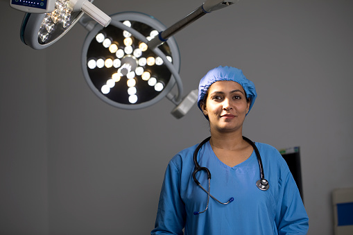 Portrait of female surgeon at hospital operating room