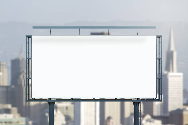istock Blank white horizontal billboard on city buildings background at daytime, front view. Mockup, advertising concept 1394904693