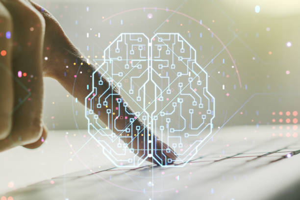 istock Creative artificial Intelligence concept with human brain hologram and hands typing on laptop on background. Multiexposure 1394905095