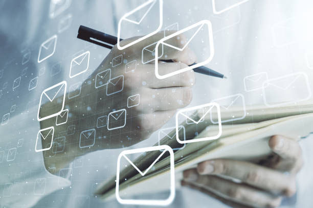 istock Creative concept of postal envelopes illustration with hand writing in notebook on background. Email and communications concept. Multiexposure 1394905105