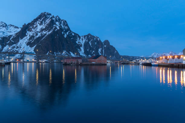 Svolvaer by dusk in Vagan Nordland Lofoten archipelago  North of Norway . On the island of Lamholmen, in the middle of Svolvær Harbour. Svolvaer by dusk in Vagan Nordland Lofoten archipelago  North of Norway  On the island of Lamholmen, in the middle of Svolvær Harbour. harbor of svolvaer in winter lofoten islands norway stock pictures, royalty-free photos & images