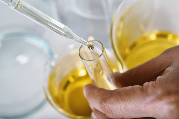 istock Oil dropping, Chemical reagent mixing, Laboratory and science experiments, Formulating the chemical for medical research, Quality control of petroleum industry products concept. 1394913439