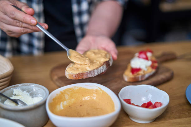 istock making breakfast toast, with peanut butter, cheese and salmon 1394914368