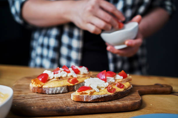 istock breakfast toast, topped with peanut butter, cheese and salmon 1394914374