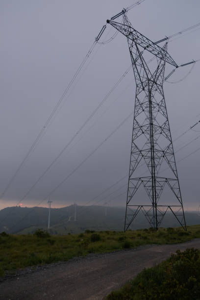 istock Wind farm with clouds at sunrise 1394914894