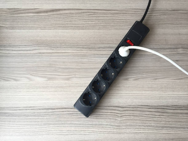 istock Old and dusty electrical outlet extenison cord on the wood table 1394915557