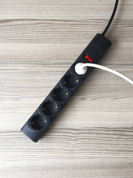 istock Old and dusty electrical outlet extenison cord on the wood table 1394915567