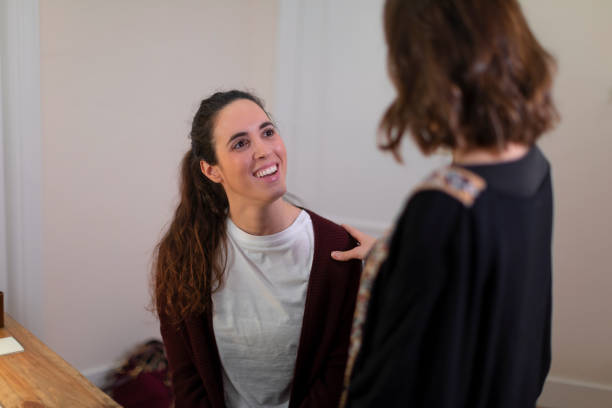 istock A female patient smiles to her therapist 1394915680