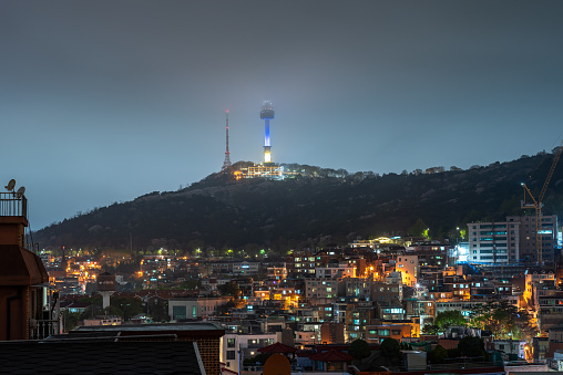 Itaewon district and Namsan Tower in Yongsan, Seoul, South Korea at night on April 12, 2022