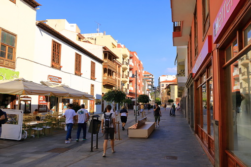 November 20 2021 - Puerto de la Cruz, Tenerife, Canary Islands, Spain: Colourful houses and tourists in the centre of village