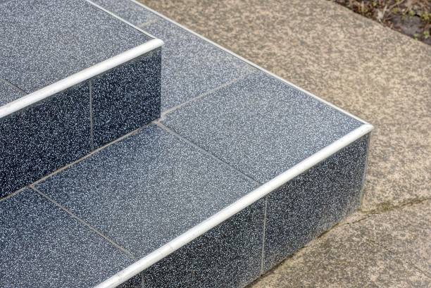 istock part of a stone threshold with black steps on gray asphalt 1394919138