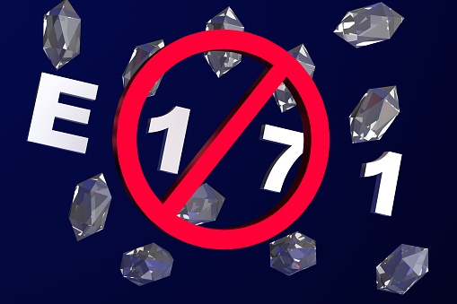 Crystals of additive E171. Danger and prohibition Titanium dioxide concept. Blue background. Prohibition sign. 3D render.