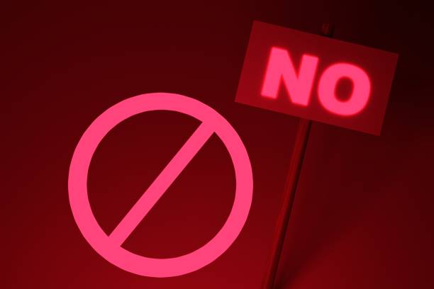 istock Prohibition sign on a dark red background. 3D render. 1394920703