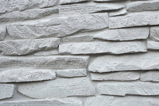 istock grey wall of imitation natural stone made with cement 1394920751
