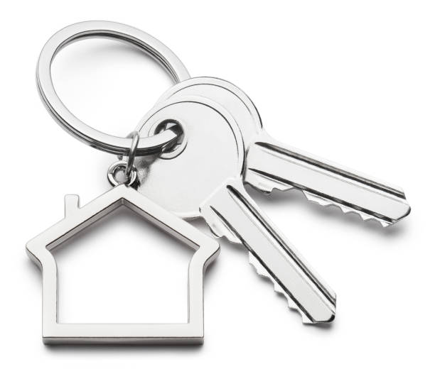 istock House keys with house shaped keychain on white 1394923005