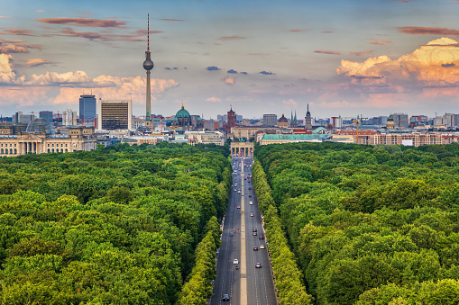 Berlin city skyline in Germany, aerial view above Tiergarten park towards the Brandenburg Gate.