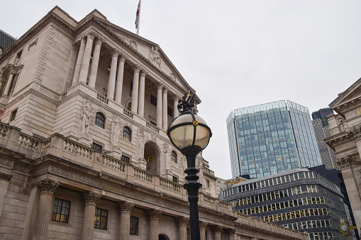 A Union flag flying over the Bank of England, the central bank of the United Kingdom, located on Threadneedle Street in the City of London.