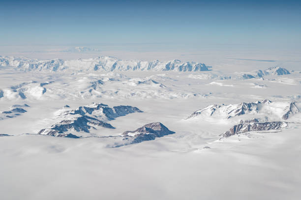 Ice cap covering the Antarctic continent and mountains Seen from the sky ice cap on the antarctic continent with emerging mountain peaks south pole stock pictures, royalty-free photos & images